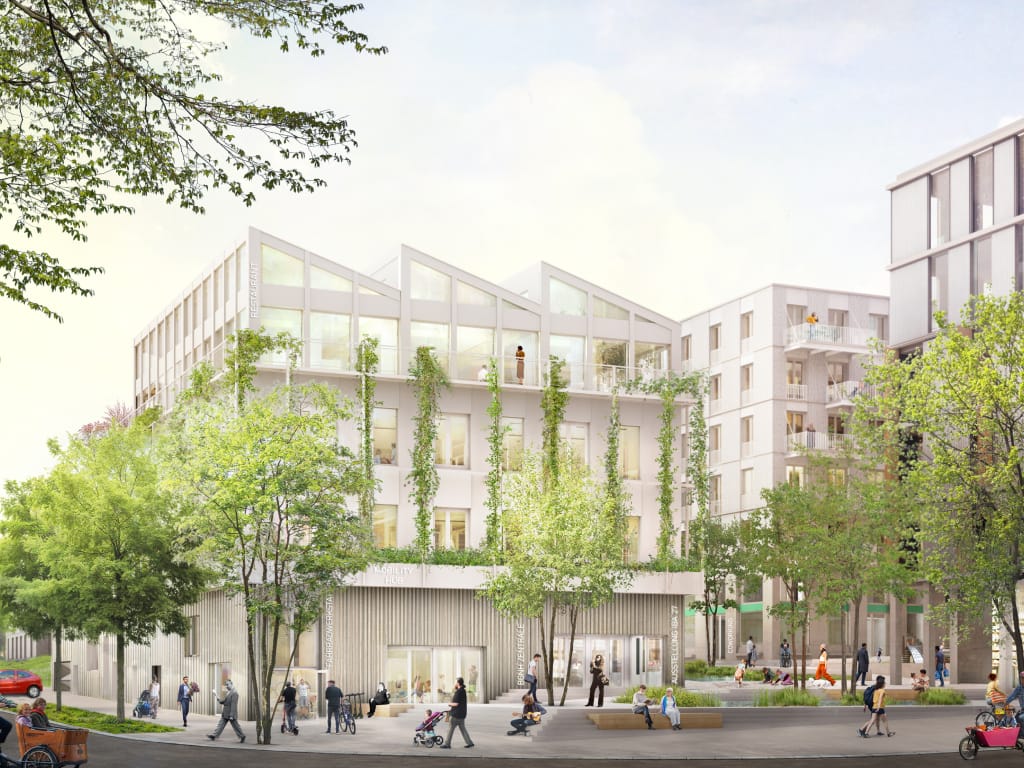 Visualisierung des Quartiers am Rotweg: begrünte Neubauten mit Sägezahndach, davor ein Platz mit Bäumen, Menschen und Fahrrädern